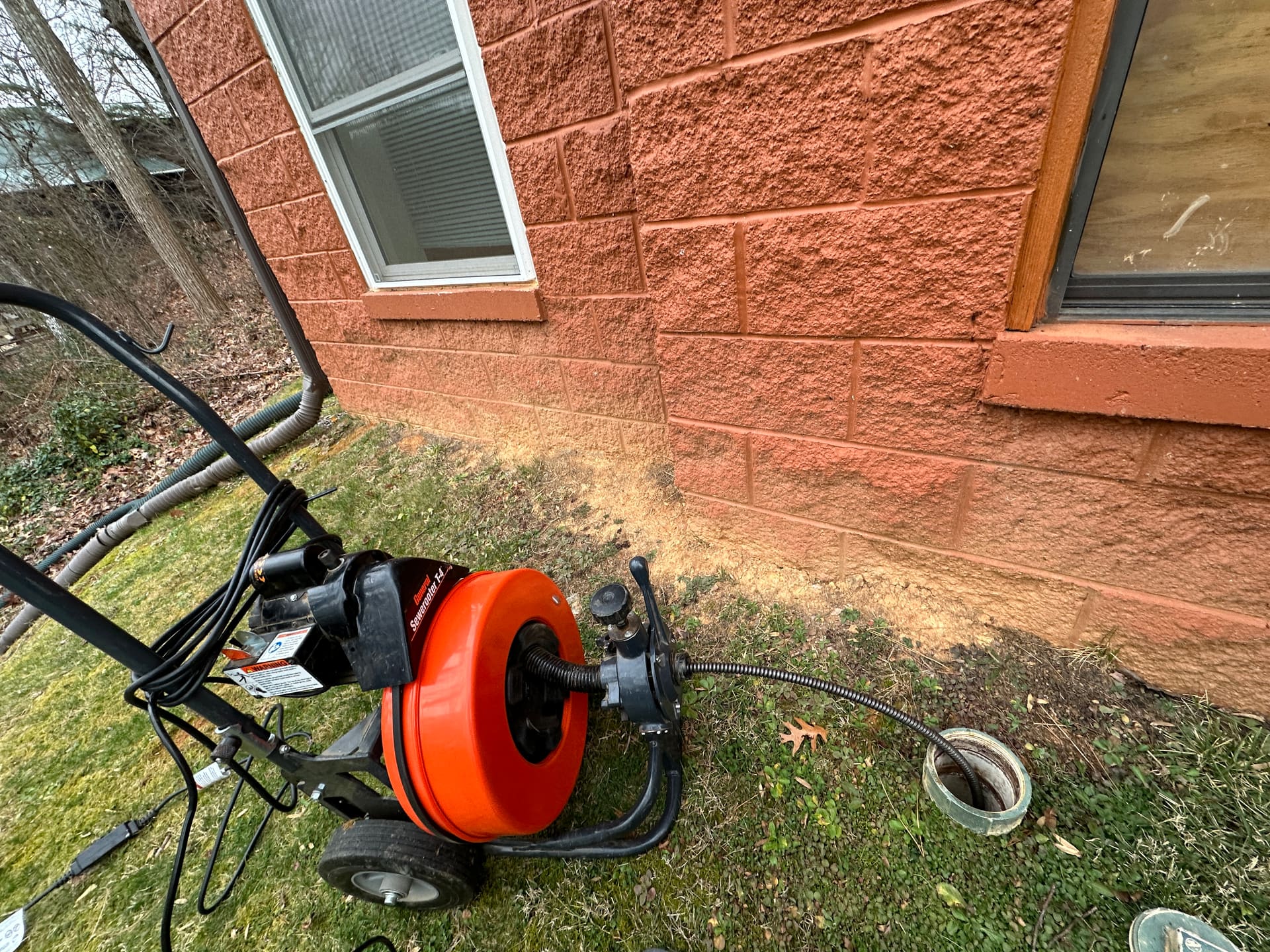 Speed King professional sectional drain cleaning machine at outdoor cleanout