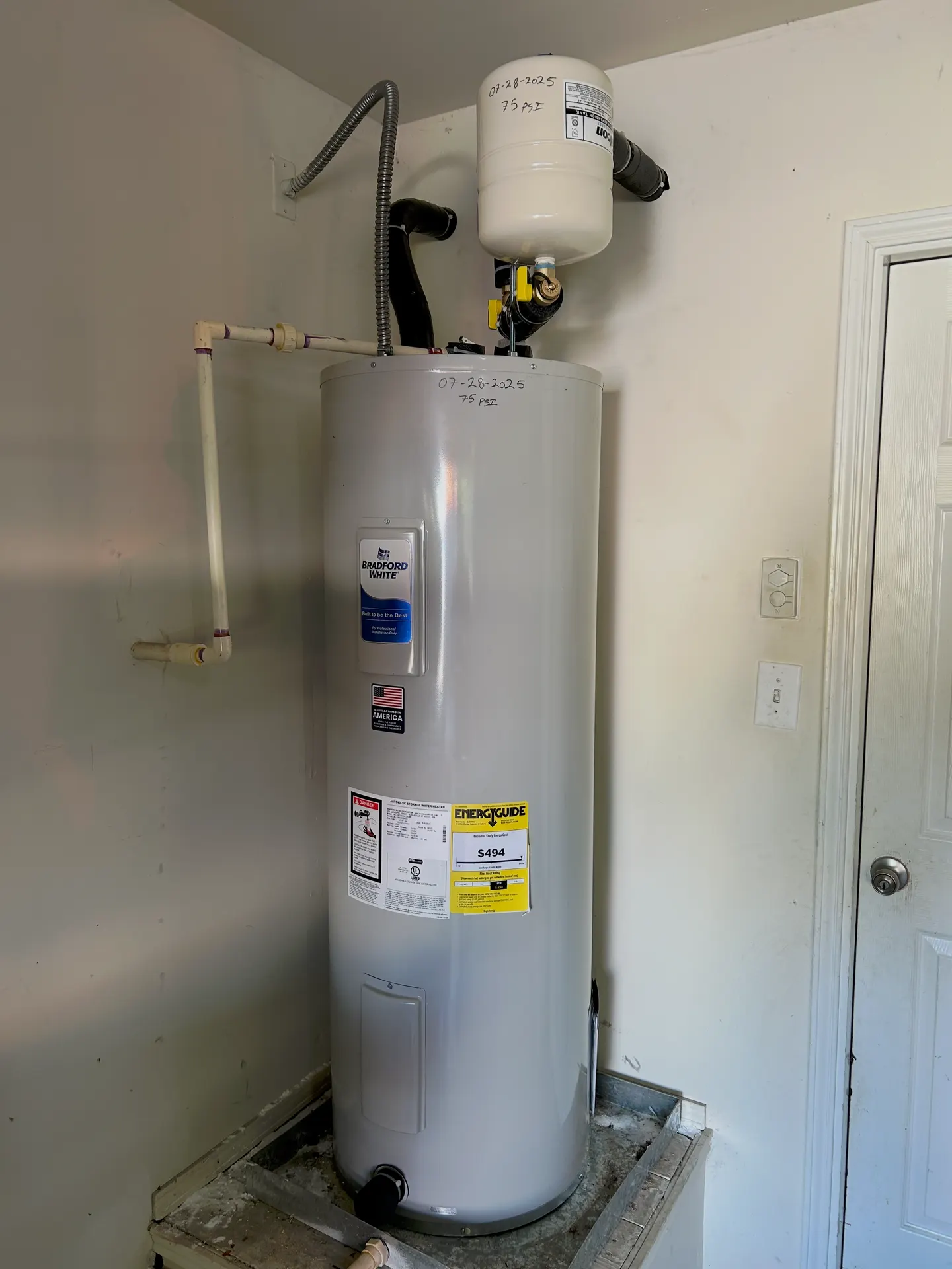 Speed King Plumbing and Leak Locating professional water heater installation: Bradford White tank with expansion tank, new flex lines, and drain pan