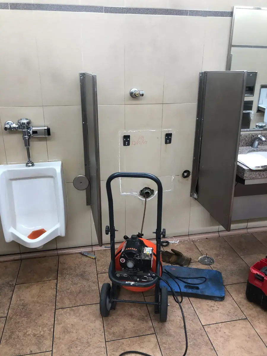 Commercial Restroom: Drain Auger Behind Wall